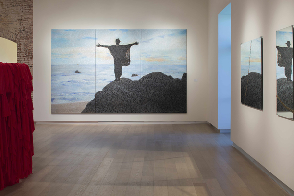 The Divine Comedy: Heaven, Purgatory, and Hell Revisited by Contemporary African Artists, installation view, SCAD Museum of Art. Bili Bidjocka, Purgatorio Le Vestibule de L’Enfer E’criture Infinie, 2014; mixed media on canvas; 110 x 177 inches. (right) Kader Attia, Repair Analysis (detail), 2013; three mirrors with metal staples; two 62 x 47 ¼, one 47 ½ x 27 ½. Courtesy of SCAD Museum of Art, photo by Marc Newton.
