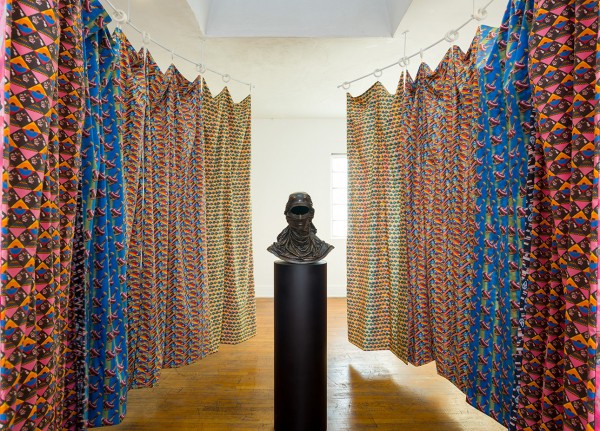 Jemima Wyman. Conjuring Radical Openness, 2015; Bronze; 20 x 19 x 9 in.; Unique edition of 3 + 1 A.P. Courtesy the artist and Commonwealth & Council, Los Angeles. Jemima Wyman. Conjuring Power, 2015; DIY fabric-prints on cotton poplin, painted steel rods; Site-specific installation; dimensions variable. Courtesy the artist and Commonwealth & Council, Los Angeles.