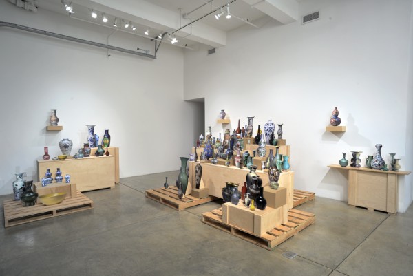 Stephanie Syjuco. RAIDERS: International Booty, Bountiful Harvest (Selections from the Collection of the A____ A__ M_____) (installation view), 2011; digital archival photo prints mounted onto laser-cut wood, hardware, crates; dimensions variable. Courtesy of the Artist and Catharine Clark, San Francisco.